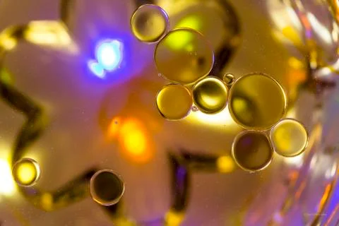 Coloured Bubbles on Water Surface: Globules Stock Photos