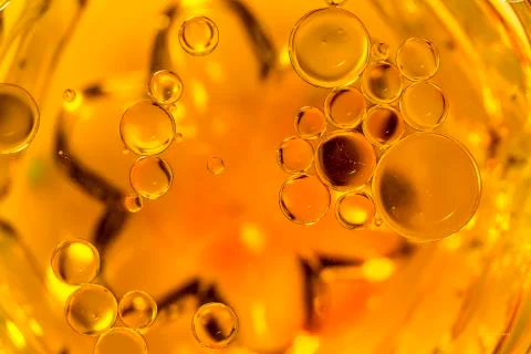 Coloured Bubbles on Water Surface: Globules Stock Photos