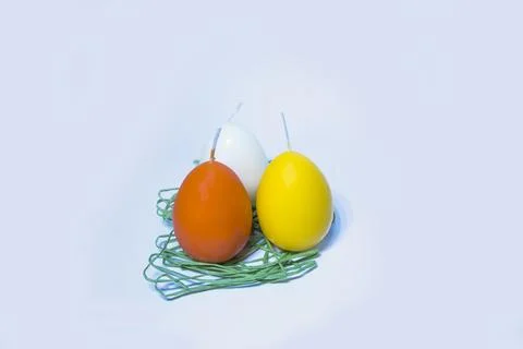 Coloured candles for easter 2023 Stock Photos