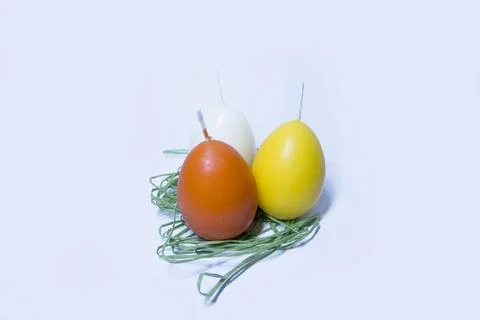 Coloured candles for easter 2023 Stock Photos