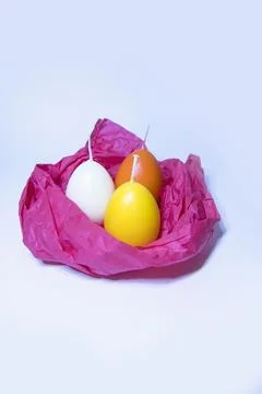 Coloured candles for easter 2023 Stock Photos