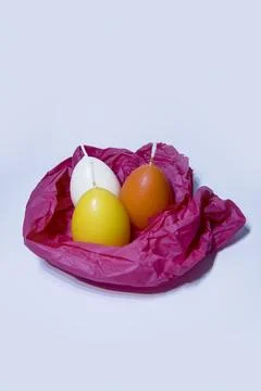Coloured candles for easter 2023 Stock Photos