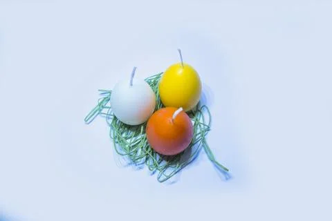 Coloured candles for easter 2023 Stock Photos