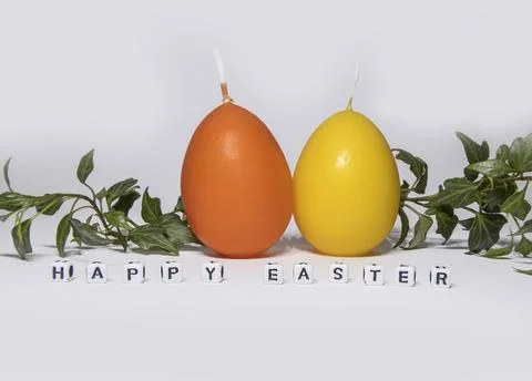 Coloured candles for easter 2023 Stock Photos