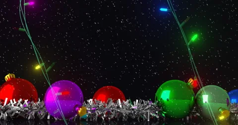 Coloured christmas string lights flashing over tinsel and colourful baubles on Stock Footage 310924858