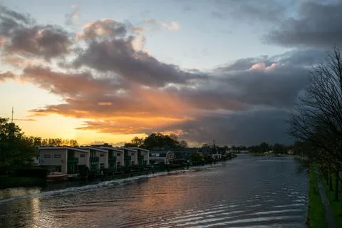 Coloured Clouds over a River Stock Photos