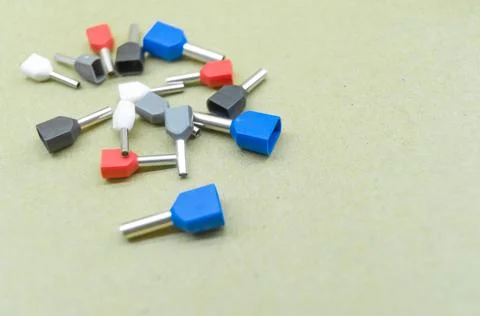 Coloured crimp terminals for different wire sizes. Copper sleeves for crimping Stock Photos