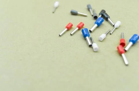 Coloured crimp terminals for different wire sizes. Copper sleeves for crimping Stock Photos