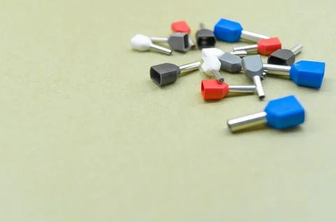 Coloured crimp terminals for different wire sizes. Copper sleeves for crimping Stock Photos