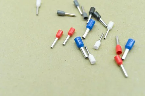 Coloured crimp terminals for different wire sizes. Copper sleeves for crimping Stock Photos