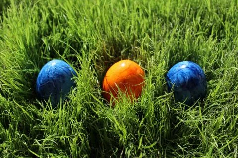 Coloured eastereggs in eastergrass Stock Photos