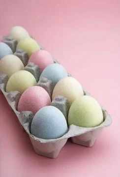 Coloured Eggs in a Carton. Easter Day Concept, Pink Background Stock Photos