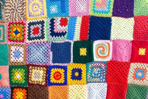 Coloured knitted carpet textile background Stock Photos