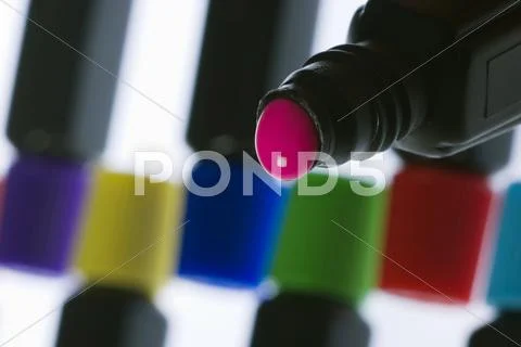 Coloured paint in a bottle Stock Photos