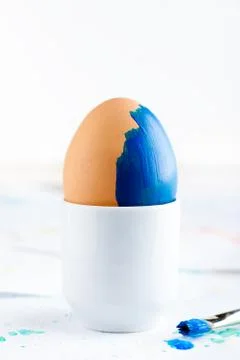 Coloured Painted Easter Egg with a Brush Stock Photos