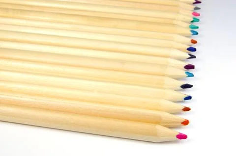 Coloured pencils lying in a row Foto stock