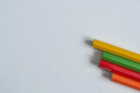 Coloured pencils on a white background. Selective focus. Stock Photos