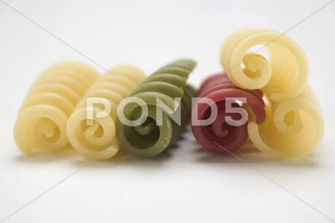 Coloured riccioli in a row Stock Photos