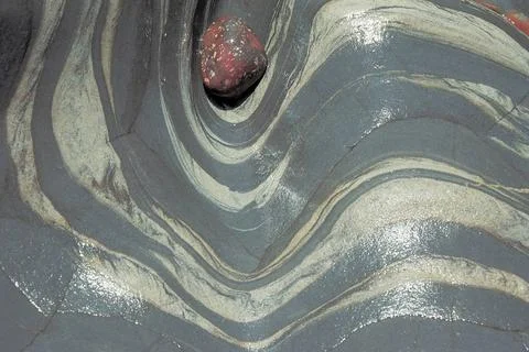 Coloured rock pattern and pebble, Point lobos, California, U.S.A. United S... Stock Photos