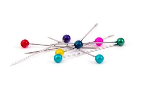 Coloured sewing pins on a white background isolated Stock Photos