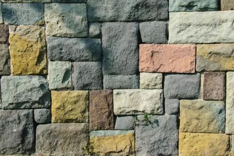 Coloured stone wall texture background material, pattern, surface Stock Photos