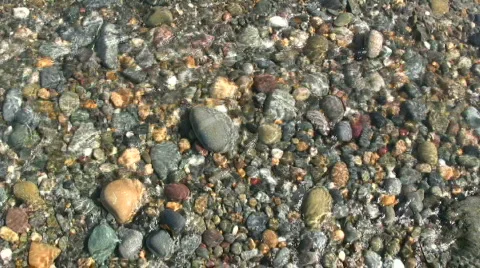 Colourful beach pebbles Stock Footage