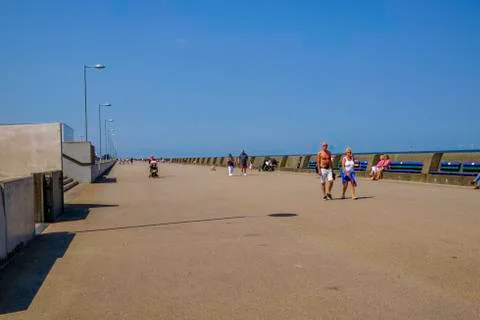 Colourful benches on the seafront at New Brighton UK Stock Photos