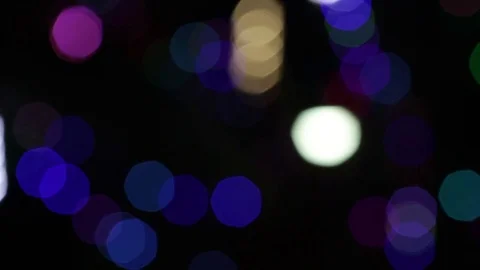 Colourful bokeh with different lights turning on and off intermittently Stock Footage 83800207