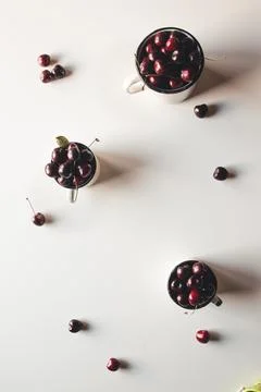 Colourful bright pattern with ripe cherry and leaf. Top view. Stock Photos