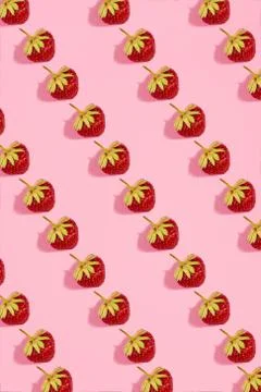 Colourful bright pattern with ripe strawberry. Top view. Pink background Stock Photos