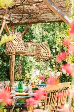 Colourful decorated table in summer setting. Garden party. Lunch. Summer garden Stock Photos