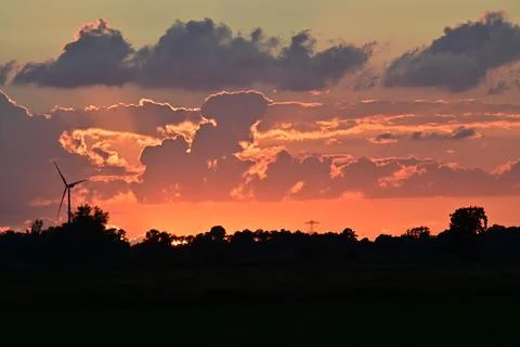 Colourful dramatic sky with clouds during sunset Stock Photos