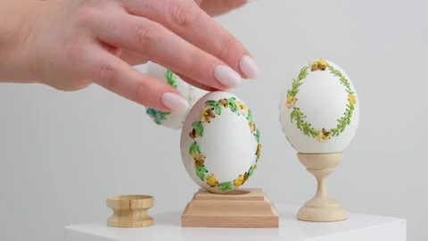 Colourful Easter eggs with different patterns aligned on a blue background Stock Footage 273167705