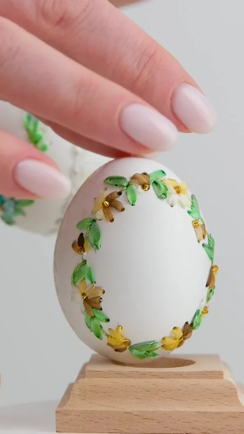 Colourful Easter eggs with different patterns aligned on a blue background Stock Footage 273171703