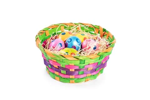 Colourful Easter eggs with polka dots in a colorful basket Stock Photos
