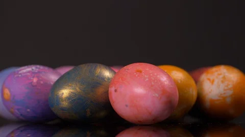 Colourful Easter Eggs Rotating on Black Background. Easter Video stock 129071450