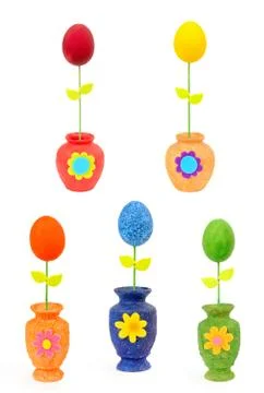 Colourful Easter eggs in vases. Isolated on the white Stock Photos