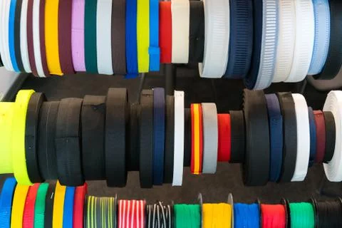 Colourful embroidery thread spool using in garment industry, row Stock Photos