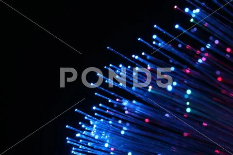 Colourful fibre optic lamp close-up photograph showing single glowing fibres Stock Photos