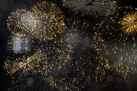 Colourful fireworks exploding on black background Illustrazione stock