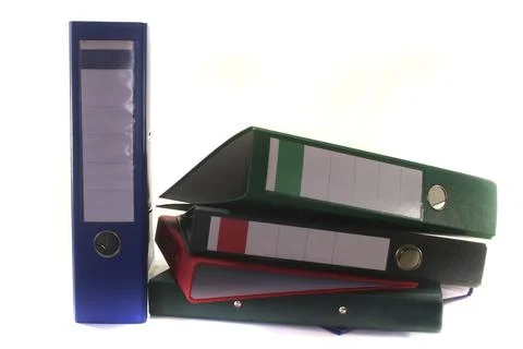 Colourful folders on a stack in front of a white background Foto stock