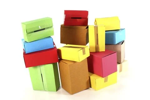 Colourful gift boxes on different stacks in front of a white background Foto stock
