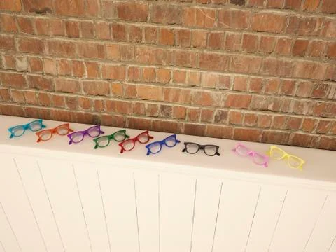 Colourful glasses on shelf Stock Illustration