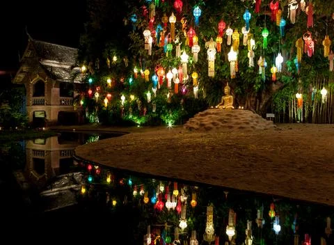 Colourful lanterns above Buddha statue. Loy Krathong festival decorations a.. Stock Illustration