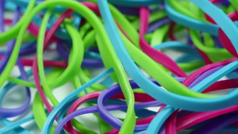 Colourful multi coloured elastic rubber bands Video stock 171584261