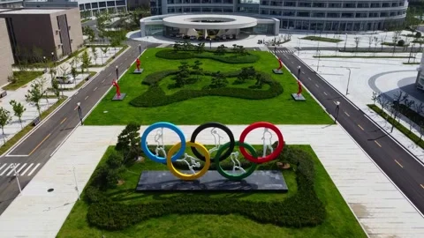 Colourful Olympic rings monument logo at Weihai Olympic Center with inlayed Stock Footage 318529138