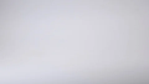Colourful paperclips fall in slow motion Stock Footage 117349402