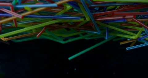 Colourful Plastic Straws Floating Around In The Sea. Plastic Polluting The World Stock Footage 112836938