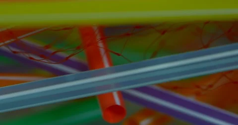 Colourful Plastic Straws Floating On The Polluted Water With Other Plastic  Stock Footage 113363194