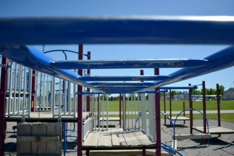 Colourful playground monkey bars in school yard. Stock Photos